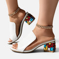 Pantoletten mit Schmuckabsatz und Transparentdetails