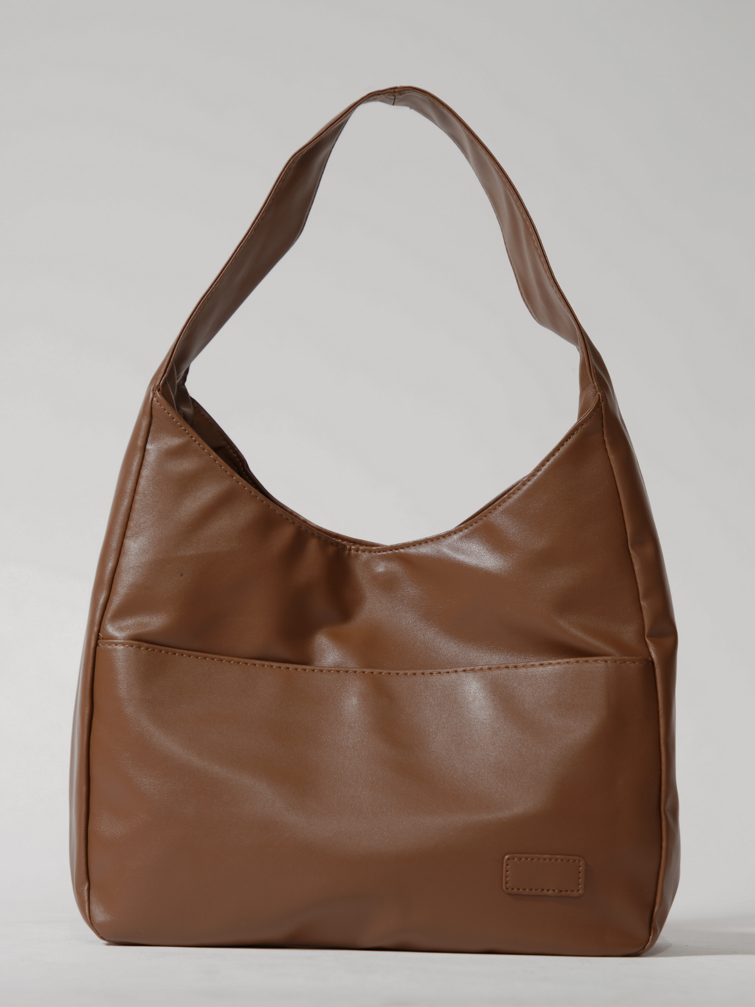 Elegante runde Schultertasche für Damen aus veganem Leder
